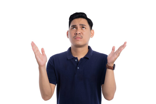 Confused Asian man raising hands and looking up with questioning expression isolated on transparent background