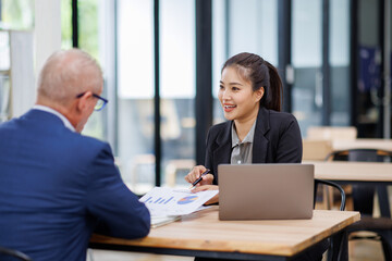 Businesswoman financial expert analyzes business report graph and chart at the office. Concept of financial economy and marketing research.	