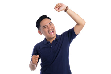 Cheerful man celebrating success with raised fist and happy facial expression isolated on...
