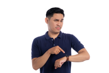 Serious man pointing at wristwatch while looking impatient isolated on transparent background