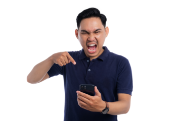 Angry man shouting and pointing at smartphone while looking frustrated isolated on transparent background