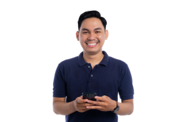 Smiling man holding smartphone while texting or browsing with cheerful expression isolated on transparent background