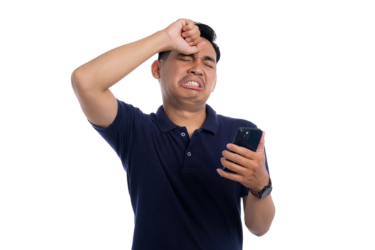 Frustrated man looking at smartphone while expressing disappointment with hand on forehead isolated on transparent background