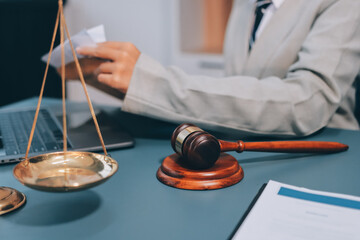 Judge gavel with Justice lawyers having team meeting at law firm background. Concepts of Law and...