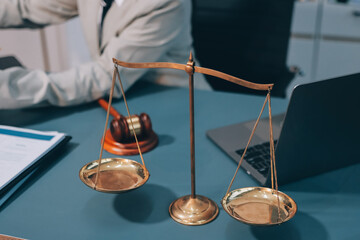 Judge gavel with Justice lawyers having team meeting at law firm background. Concepts of Law and...
