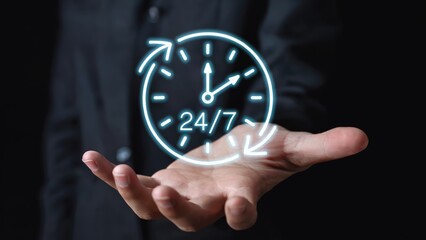 24/7 service concept with glowing clock projected over hand for customer support access