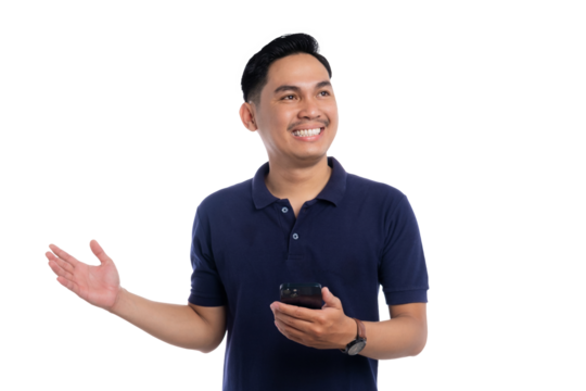 Smiling man holding smartphone with open hand gesture looking up with joyful and friendly expression isolated on transparent background