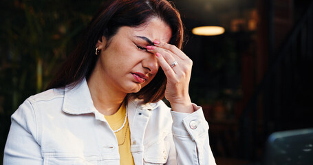 Headache, stress and woman in coffee shop with fatigue, burnout or exhaustion with freelance...