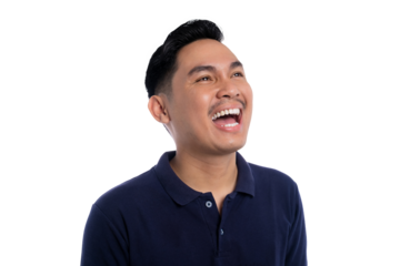 Happy young man laughing joyfully while looking up wearing navy blue polo shirt isolated on transparent background