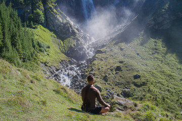 Meditation. Harmony and peace in nature. Calm athlete man meditating in environment. Mindfulness. Relaxed man in nature. Freedom and happiness. Man practicing yoga outdoors.