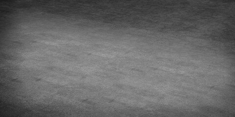 Fototapeta premium A textured concrete surface with subtle gradients and shadows.