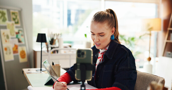 Influencer, smartphone and woman in studio, artist and content creation with creative project. Home, person and freelancer with cellphone, live streaming and graphic designer with process and talent