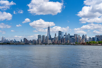 Obraz premium New York City. NYC skyline with towering skyscrapers. Manhattan and Hudson River. Panoramic cityscape of New York. Downtown NYC with landmarks. New York skyline. New York landmark.
