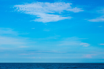 Nature of the ocean and blue sky Summer with sunshine, sandy beaches, clear blue waters sparkling against the blue sky. on an island with good ecology and environment Background for summer vacation	