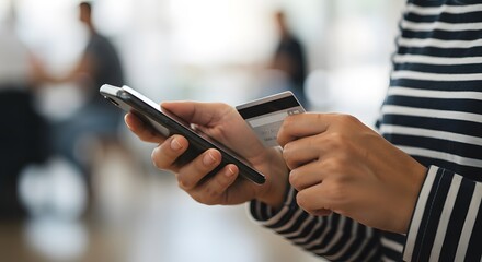 Woman using mobile phone for online banking and shopping at home