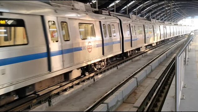 New Delhi, India, April 16 2025 - Delhi Metro train arriving at Jhandewalan metro station in New Delhi, India, Asia, Public Metro departing from Jhandewalan station