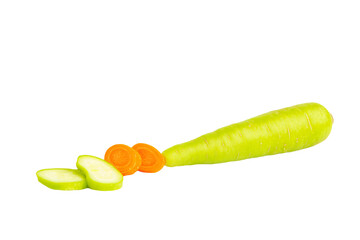 a carrot and a sliced apple on a white surface