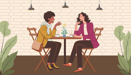 Two Women Laughing Over Coffee at an Outdoor Table