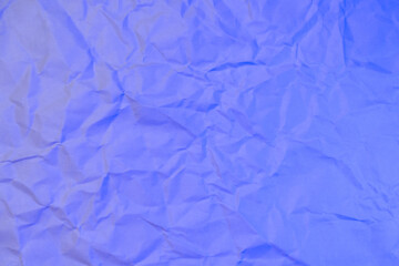 A wrinkled white paper surface bathed in soft blue lighting, offering a cool and calming backdrop for abstract design or digital templates.