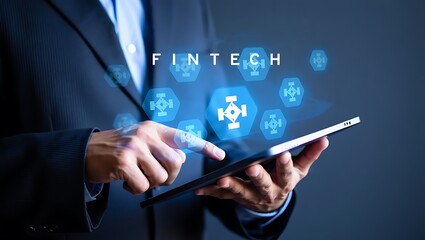 Man in Suit Using Tablet with Fintech Graphic Overlay Emphasizing Digital Finance and Technological Advancement for Business Solutions