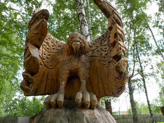 Wooden eagle sculpture with wings spread