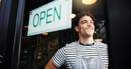 Open sign, small business and window with man in coffee shop for hospitality, retail or service....