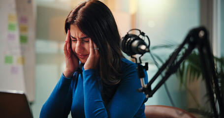 Live stream, headache and woman with stress by mic for news broadcast, burnout and talk show doubt....