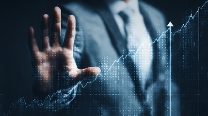 Businessman s hand stopping a rising financial graph with digital overlay