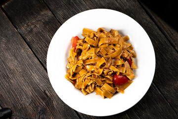 Tofu noodles on dark background. Soy cheese. Vegan food.