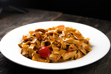 Tofu noodles on dark background. Soy cheese. Vegan food.