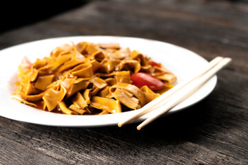 Tofu noodles on dark background. Soy cheese. Vegan food.
