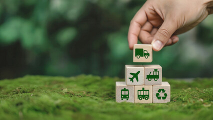 Hand stacking eco-friendly transport concept blocks outdoors