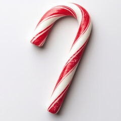 Red and white striped candy cane on white background, showcasing its classic holiday design and festive appeal