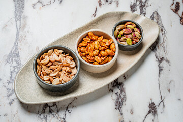 A tempting mix of roasted cashews, spicy peanuts, and seasoned pistachios awaits!
