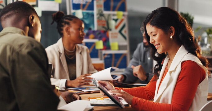 Woman, graphic designer and tablet with team at office with review, decision or project management. Person, group and happy with app for collaboration, solution and inspiration at creative agency - Powered by Adobe