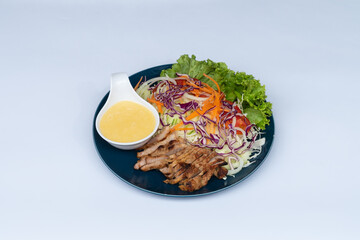 Pork steak with mayonnaise, cabbage, tomato