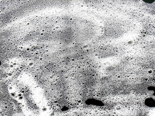 Soap foam bubbles abstract on black background. Soap water background. Clean foam abstract. Health...