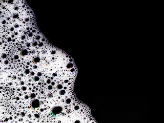 Soap foam bubbles abstract on black background. Soap water background. Clean foam abstract. Health...