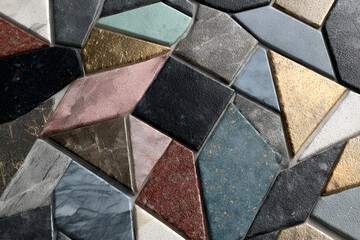 Mosaic Tiles with Geometric Pattern: A vibrant and detailed mosaic features an array of irregular geometric tiles, each displaying unique textures and colors
