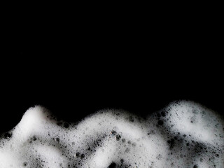Soap foam bubbles abstract on black background. Soap water background. Clean foam abstract. Health...