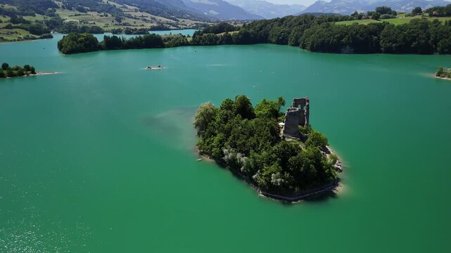 Le Bry island Lake Gruy&egrave;re Switzerland aerial drone ruined castle church turquoise blue color