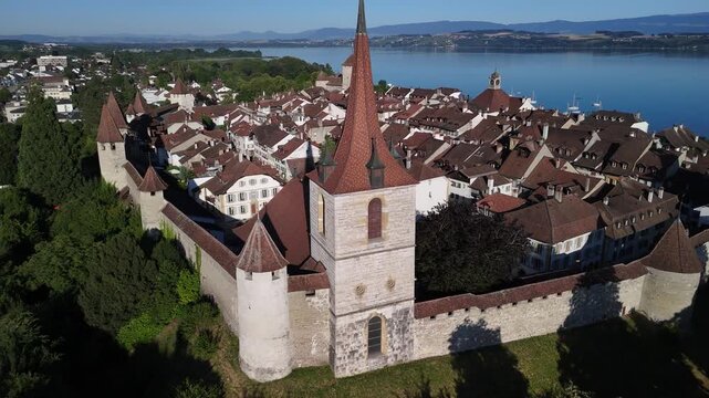 Murten medieval fortification walls town in Switzerland aerial drone Fribourg region