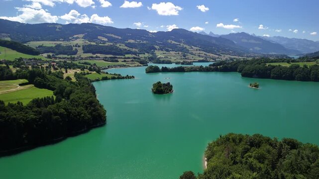 Le Bry small island Lake Gruy&egrave;re Switzerland aerial drone Fribourg canton turquoise blue water