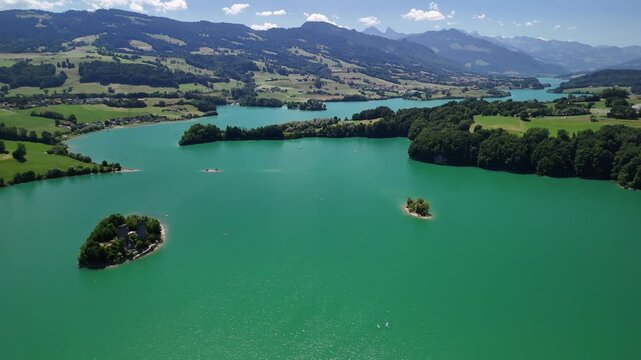 Le Bry island Greyerzersee Lake Gruy&egrave;re region artificial reservoir aerial drone Switzerland