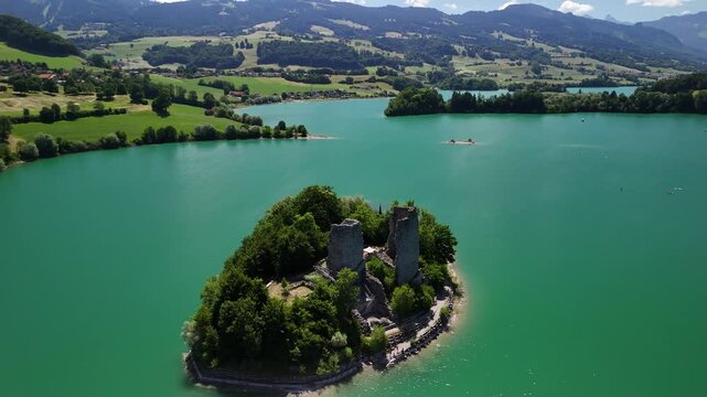 Le Bry small island on Switzerland artificial lake reservoir Gruy&egrave;re, aerial drone