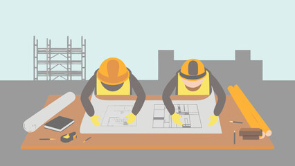 Two construction workers reviewing blueprints on a table with tools and scaffolding in the background
