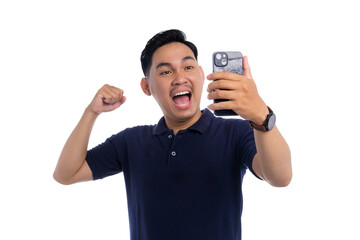 Excited Asian man celebrating while holding smartphone and making video call isolated on transparent background