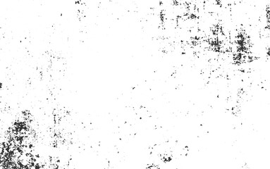 White surface with scattered dark textured marks and specks black grunge