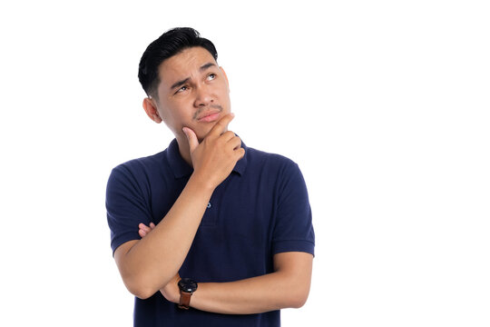 Thoughtful Asian man touching chin and looking up with thinking expression isolated on transparent background