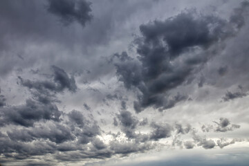 Dramatic dark and ominous storm clouds filling the sky on an overcast day.